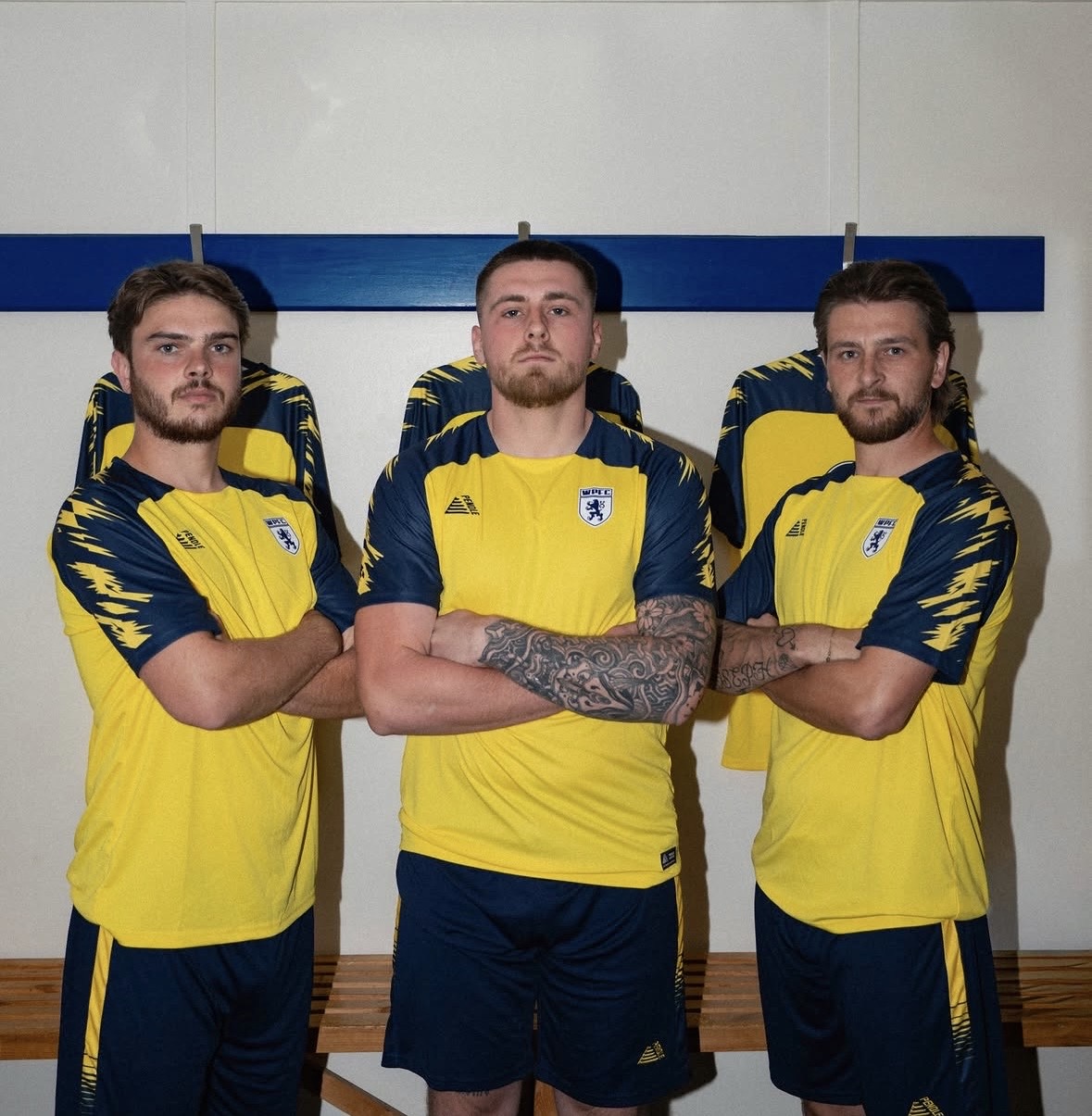 Three Worcester Park FC reserves players wearing the yellow and navy 26/27 kit